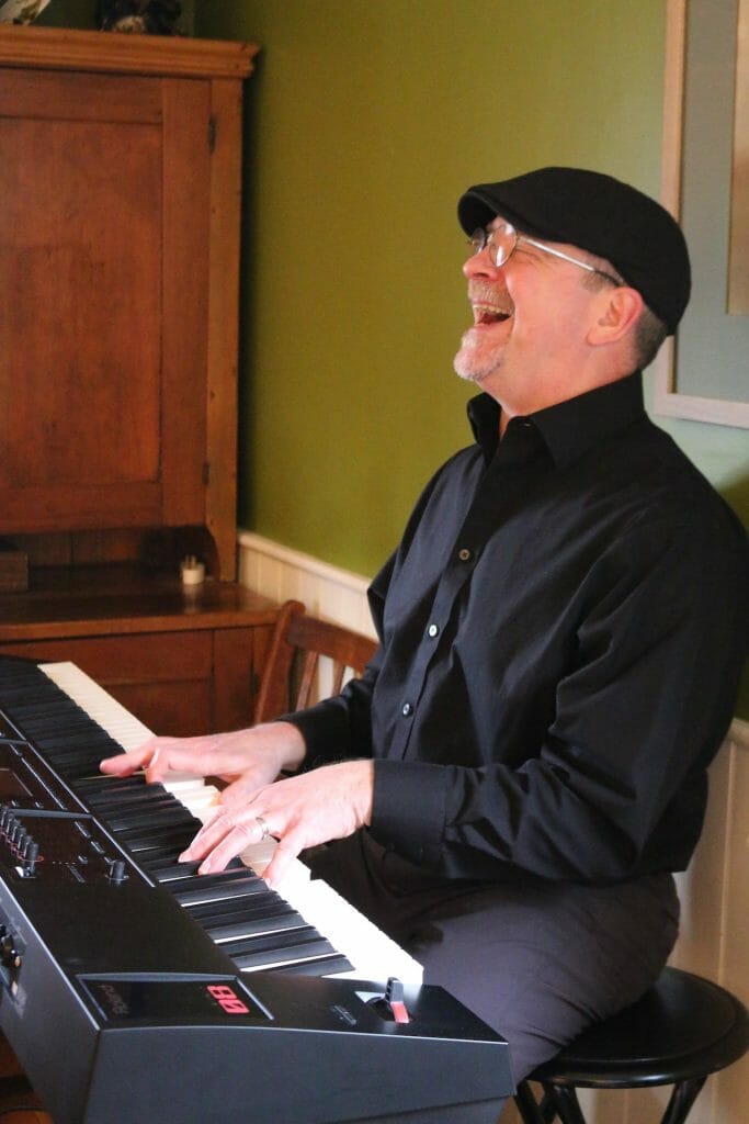 Gigs - Stan Stewart laughs while gigging on the piano