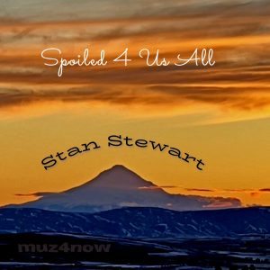 Mount Hood with a rather bright orange sky and clouds forms the cover of "Spoiled 4 Us All" by Stan Stewart.