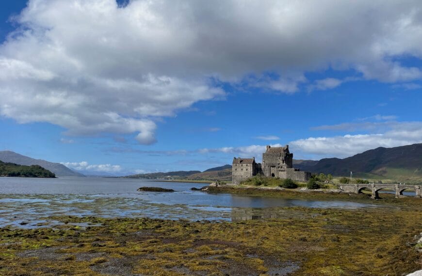 Dunin Castle in the Scottish Highlands is surrounded by a lake (loch).