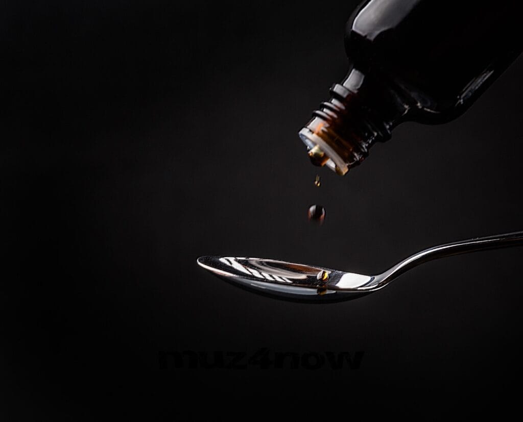 Cold syrup dripping from a bottle into a shiny spoon. Photo by Original Frank - https://pixabay.com/users/original_frank-6031334/