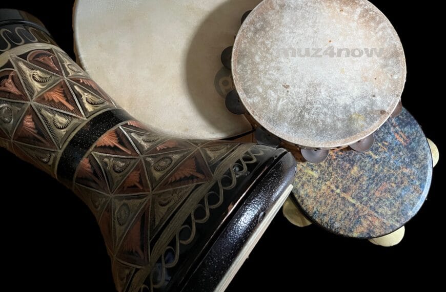 Four (4) hand drums -- a daf, tambourine, riqq, and darbuka -- waiting to be played