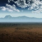 A mountain range beyond a sand covered landscape with clouds overhead represents modern parables. By https://pixabay.com/users/divotomezove-1979640/