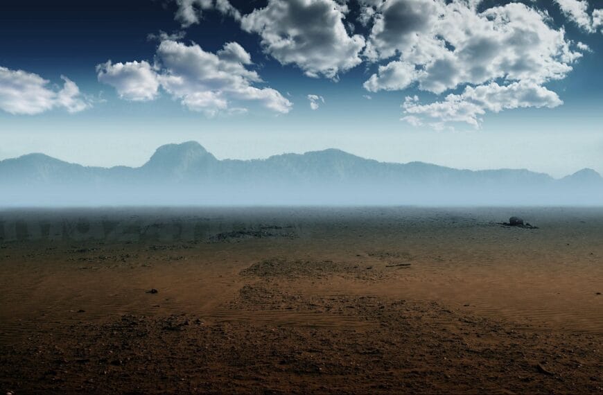 A mountain range beyond a sand covered landscape with clouds overhead represents modern parables. By https://pixabay.com/users/divotomezove-1979640/
