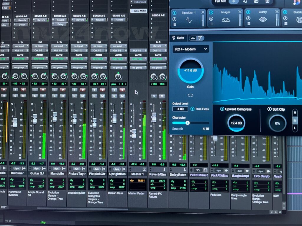 The audio meters for several tracks and a big blue plugin in the upper right fill the screen for a DAW (digital audio workstation).