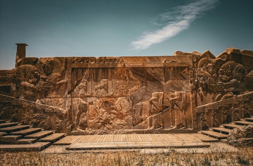 Photo of carved stone figures representing ancient Persia.
