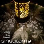 A solar light with shapes cut in the cylinder around it casts light shadows of flowers and birds on the surface in front of it. The word "singularity" is written at the bottom of the image since this is the cover art for that album by Stan Stewart.
