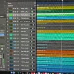 Colorful green, yellow, blue, and brown stripes on the right side of a screen represent the audio in various tracks in Logic Pro. On the left are two "faders" with green segments indicating playback is happening. In between these are the names of the individual tracks. This is one part of making music.